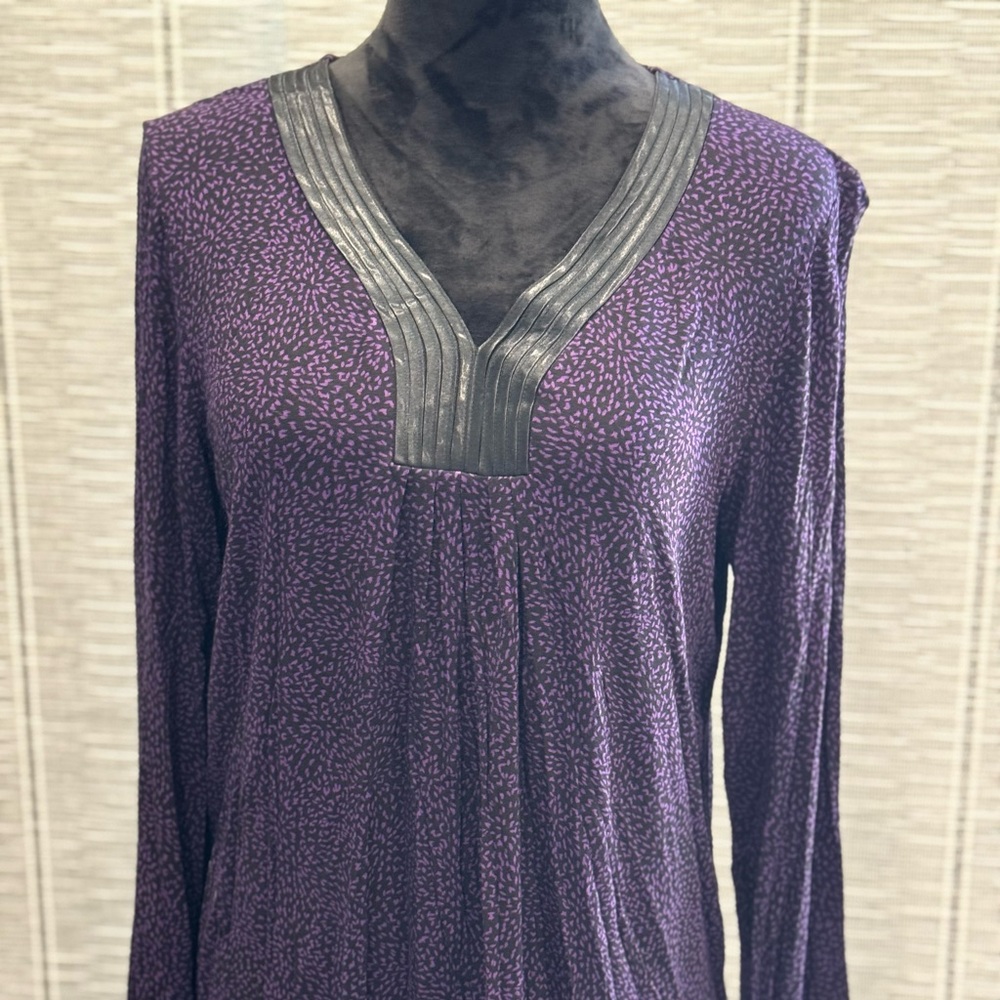 Lovely two piece pajama set featuring purple and black design.
